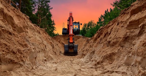 Excavator digging the ground